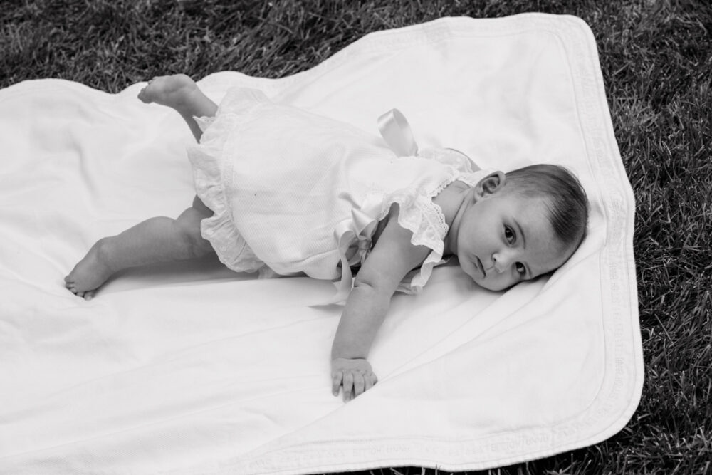 black and white photograph child on blanket